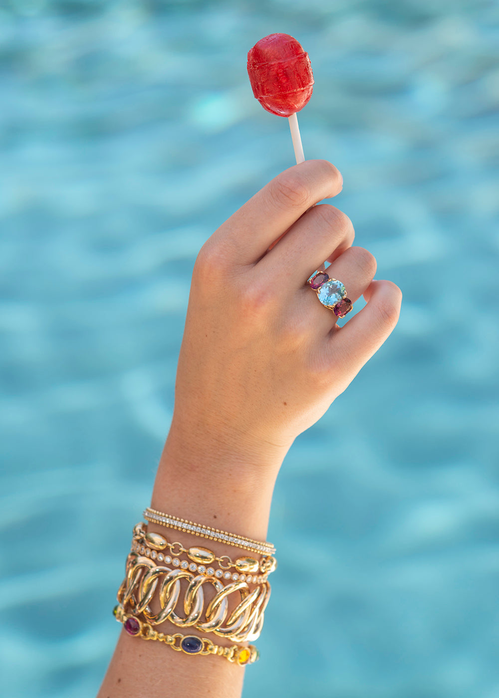 Blue Topaz & Pink Tourmaline 14K Gold River Ring styled in summer poolside bracelet stack